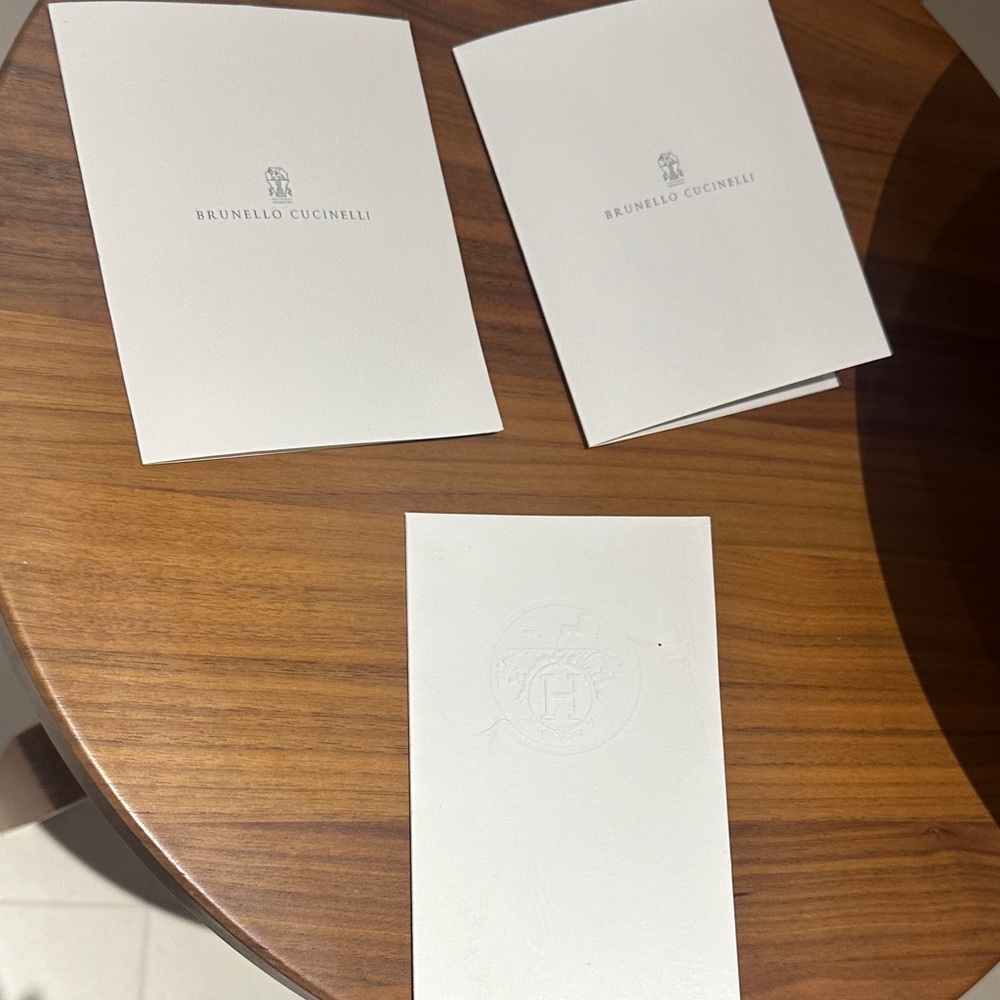 Brunello Cucinelli and Hermes receipt set.